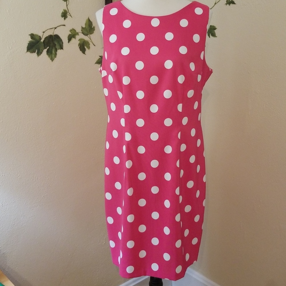 Sleeveless pink polka dot dress.